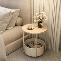 mesa de centro redonda con cesta de tela beige y blanco