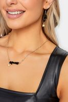 conjunto de collar y pendientes dorados y negros estrellas