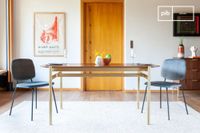 mesa de comedor de 6 plazas en madera oscura y metal dorado