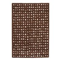 alfombra interior con lunares marrones y crema